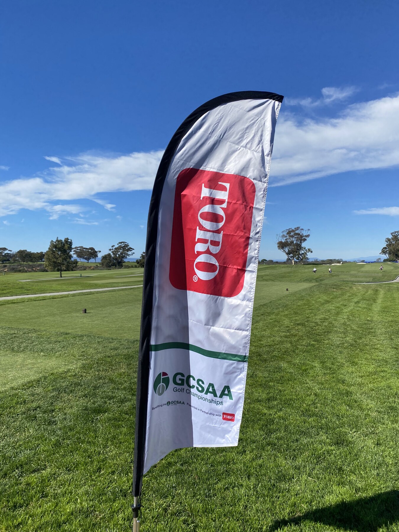 Golf course event flag displaying GCSAA and Toro logos
